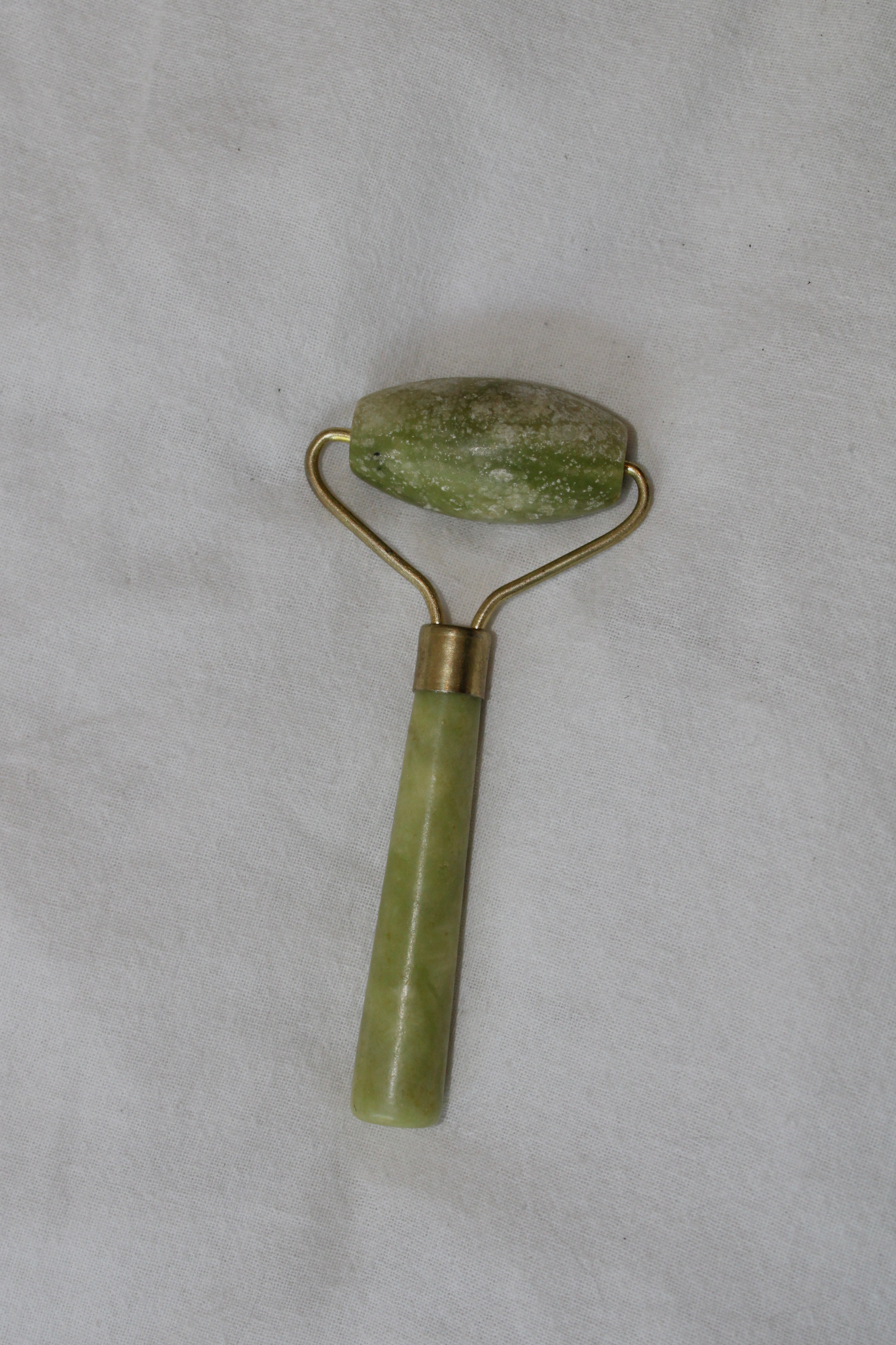 Green jade facial roller